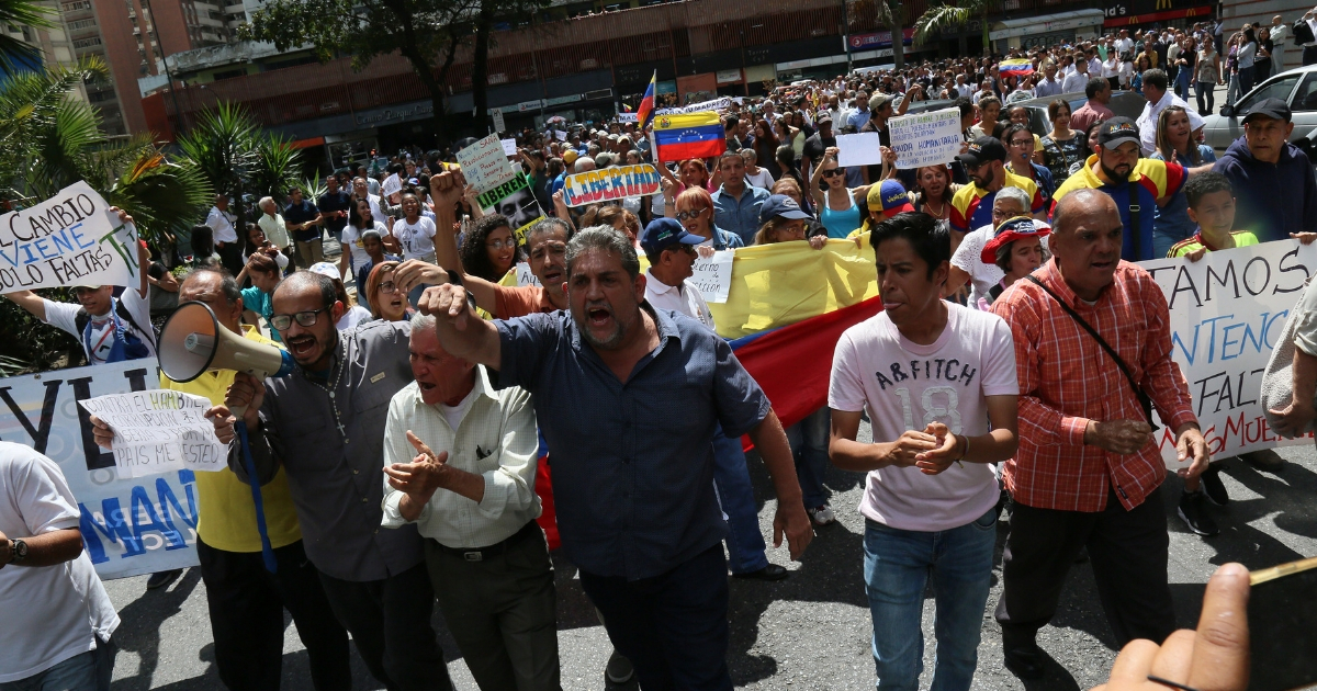 People protest during a demonstration against the government of President Nicolás Maduro called by the opposition leader and self-proclaimed 'acting president' Juan Guaido on Jan. 30, 2019, in Caracas, Venezuela.