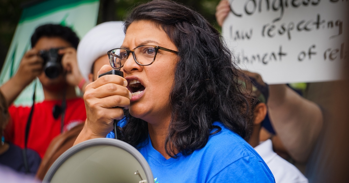 Congressional candidate Rashida Tlaib speaks in protest against the Supreme Court's ruling.