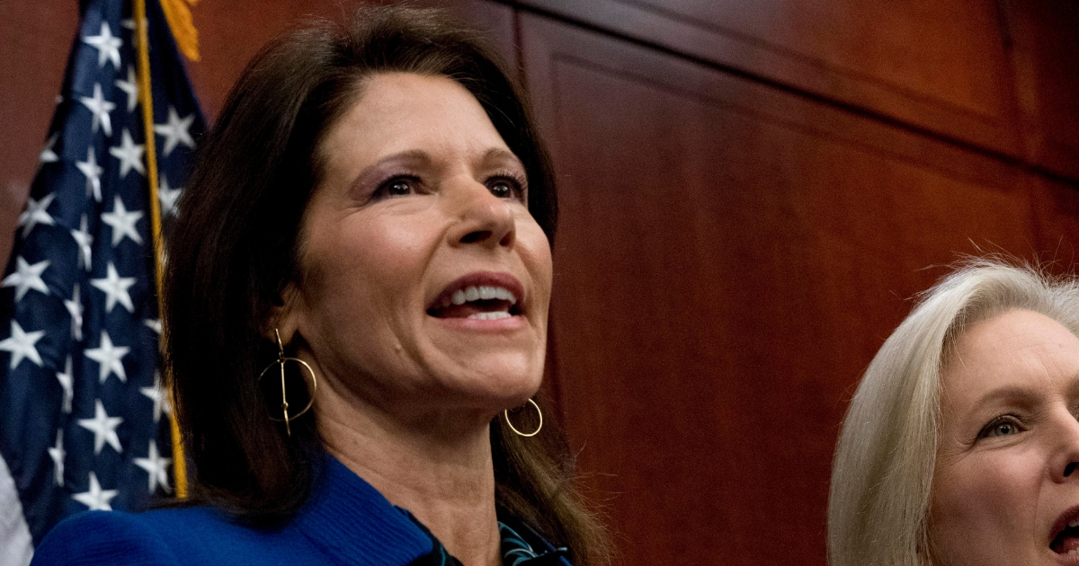 Rep. Cheri Bustos, D-Ill. speaks at a news conference where members of Congress have introduced legislation to curb sexual harassment in the workplace, on Capitol Hill, Dec. 6, 2017, in Washington.