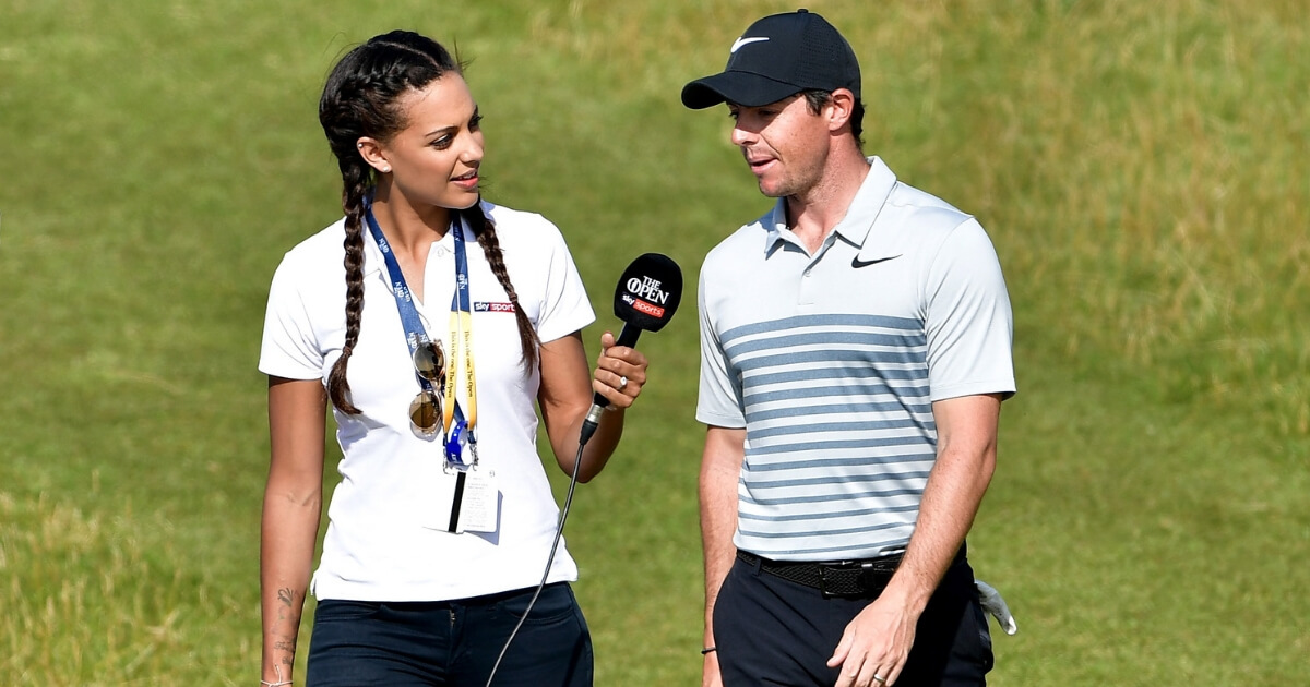 Henni Zuel of Sky Sports interviews Rory McIlroy on the course during a practice round prior to the 146th British Open Championship at Royal Birkdale on July 18, 2017.