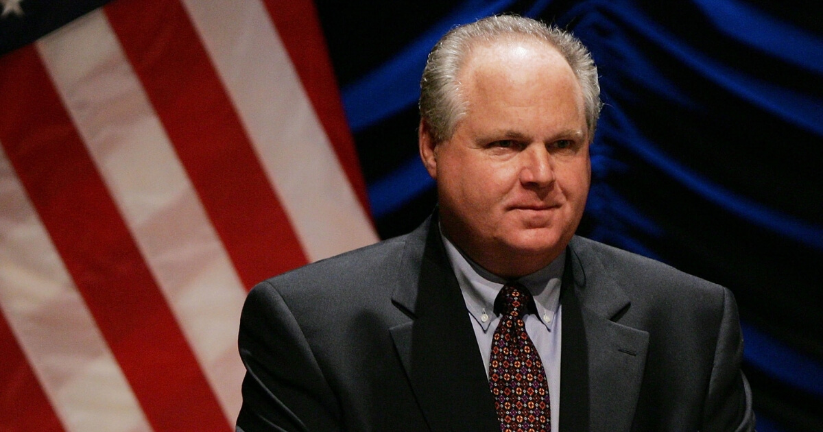 Radio personality Rush Limbaugh interacts with the audience before the start of a panel discussion on June 23, 2006.