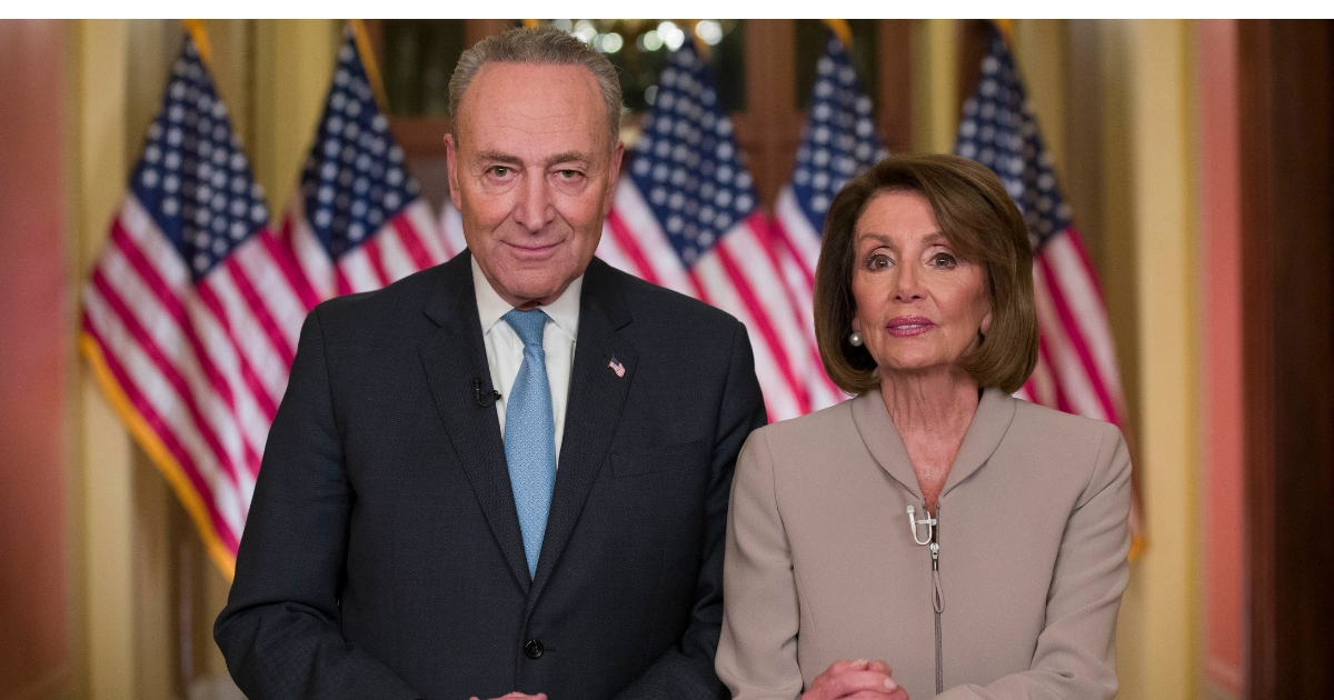 Senate Minority Leader Chuck Schumer of New York and House Speaker Nancy Pelosi of California pose for photographers after speaking on Capitol Hill in response President Donald Trump's address, Jan. 8, 2019, in Washington.