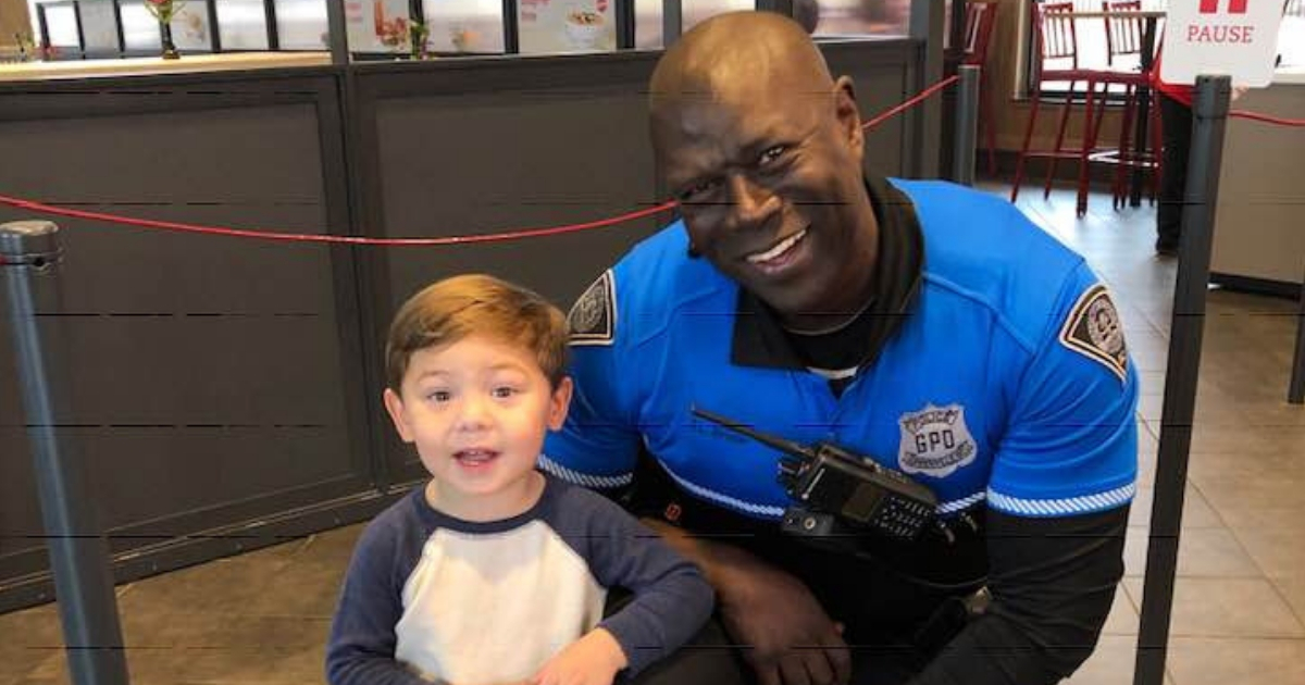 A police officer with a little boy.