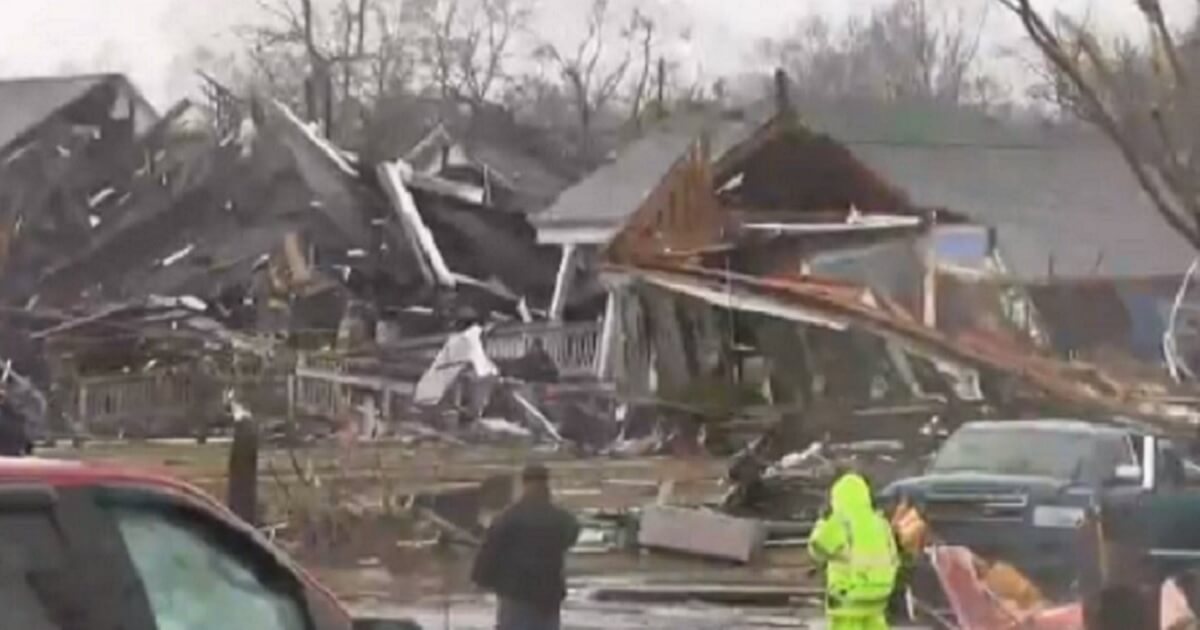 Rescuers confront the damage inflicted by a devastating tornado Saturday on the town of Wetumpka, Alabama.