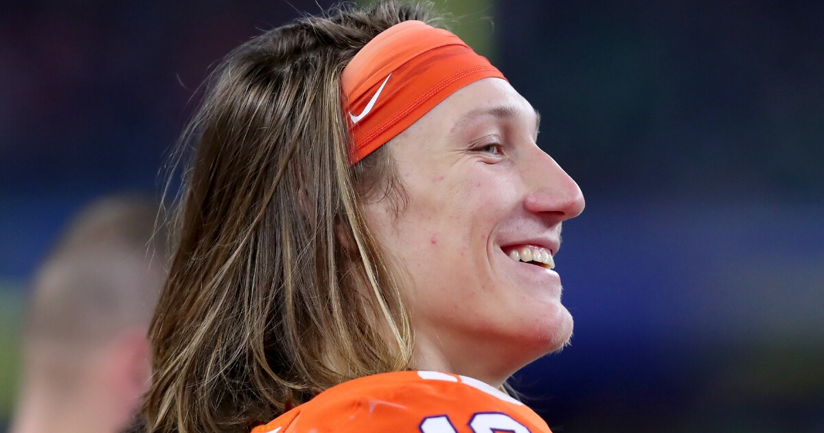 Trevor Lawrence of the Clemson Tigers celebrates after leading his team to a 30-3 victory over Notre Dame in the College Football Playoff semifinal at AT&T Stadium in Arlington, Texas, on Dec. 29.