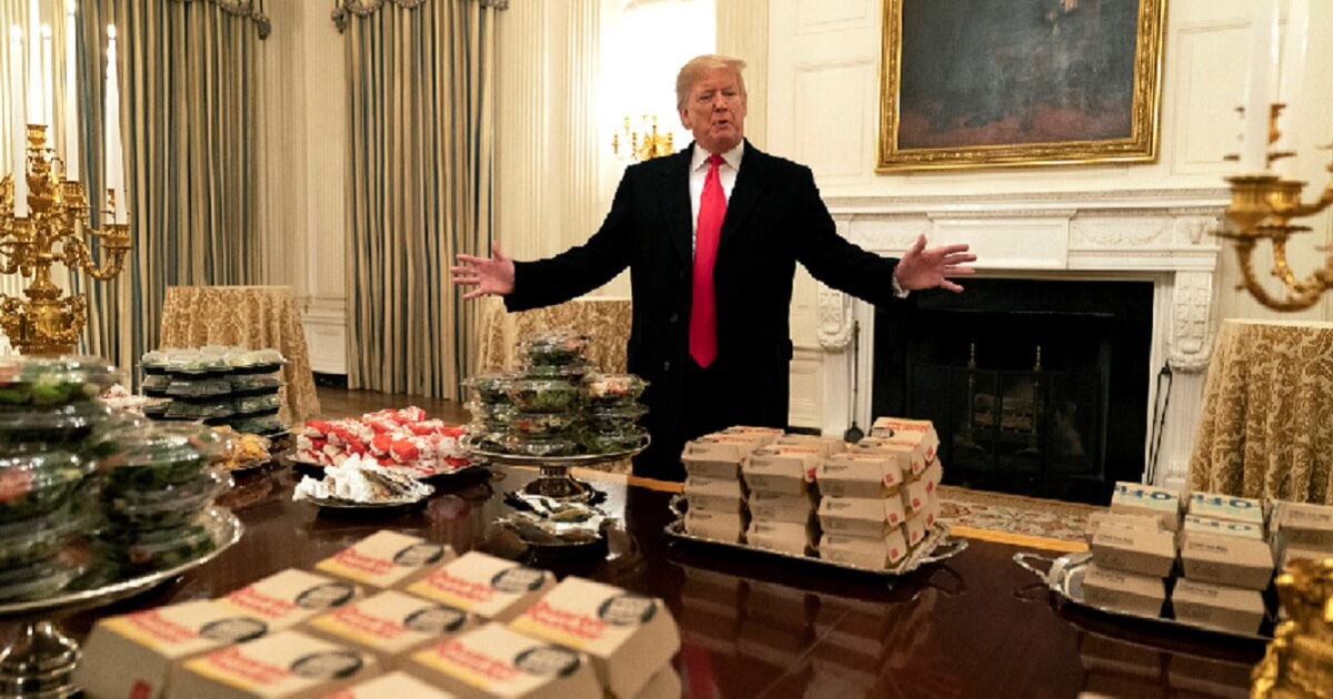 President Donald Trump presents the banquet of fast food being served Monday for the White House visit of the national champion Clemson Tigers college football team.