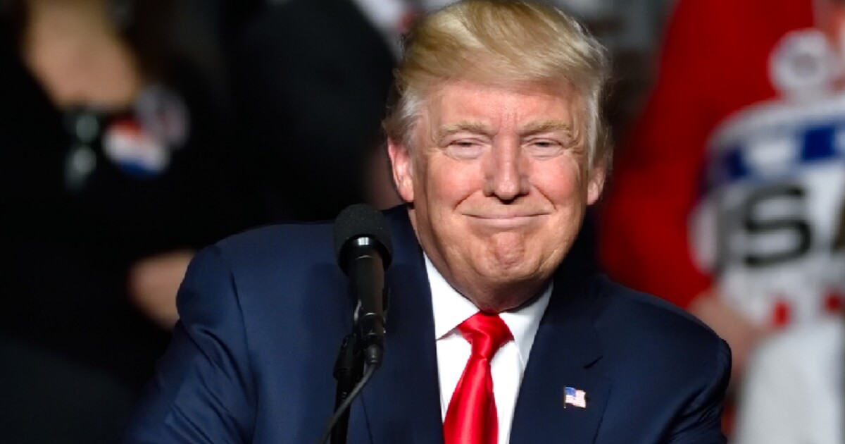 President Donald Trump smiling in file photo
