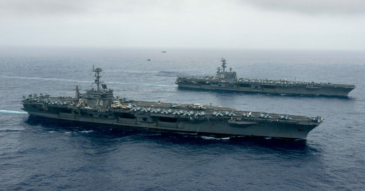 In this handout provided by the U.S. Navy, The Nimitz-class aircraft carriers USS John C. Stennis (CVN 74), center, and USS Ronald Reagan (CVN 76) conduct dual aircraft carrier strike group operations in the U.S. 7th Fleet area of operations in support of security and stability in the Indo-Asia-Pacific.
