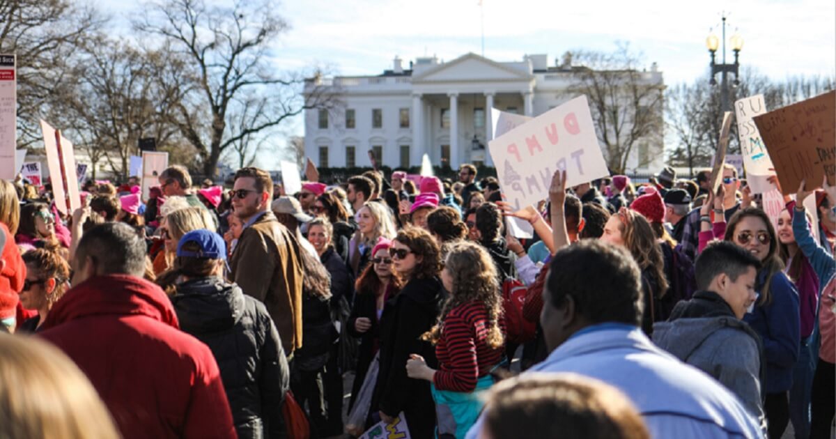 Women's March demonstrators gather in Lafayette Square in January 2018.