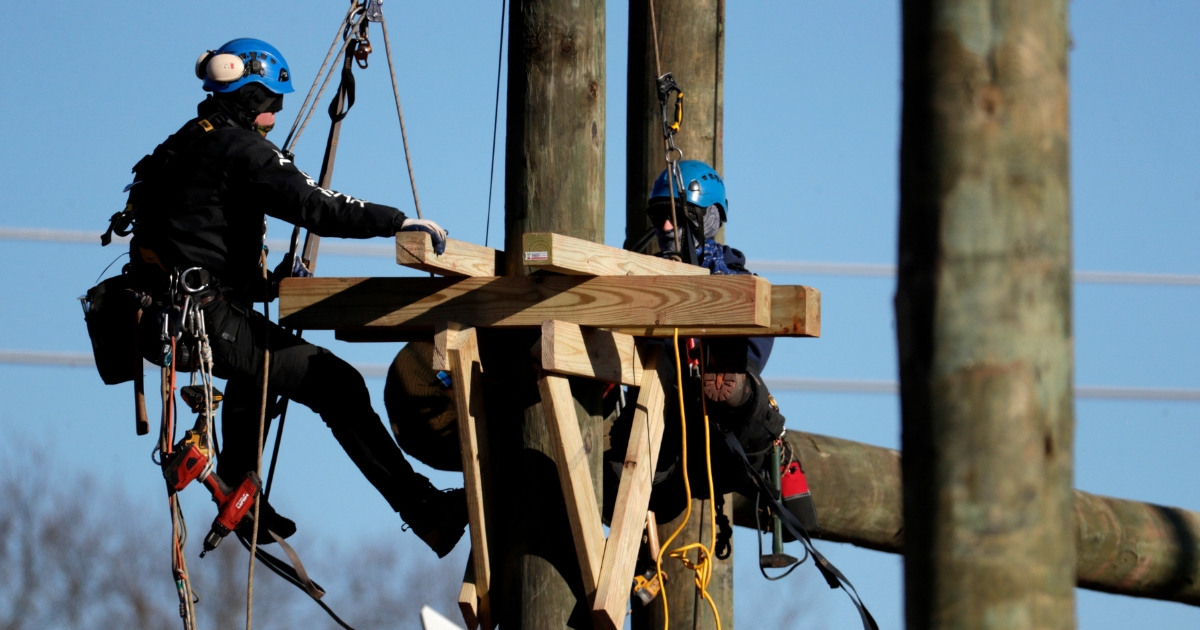 Workers attach platforms on posts Jan. 11 during construction on the grounds of a hotel in Manahawkin, New Jersey.