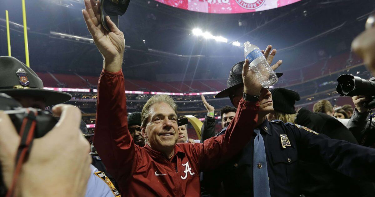 In this Jan. 8, 2018, file photo, Alabama head coach Nick Saban celebrates after overtime of the NCAA college football playoff championship game against Georgia, in Atlanta.