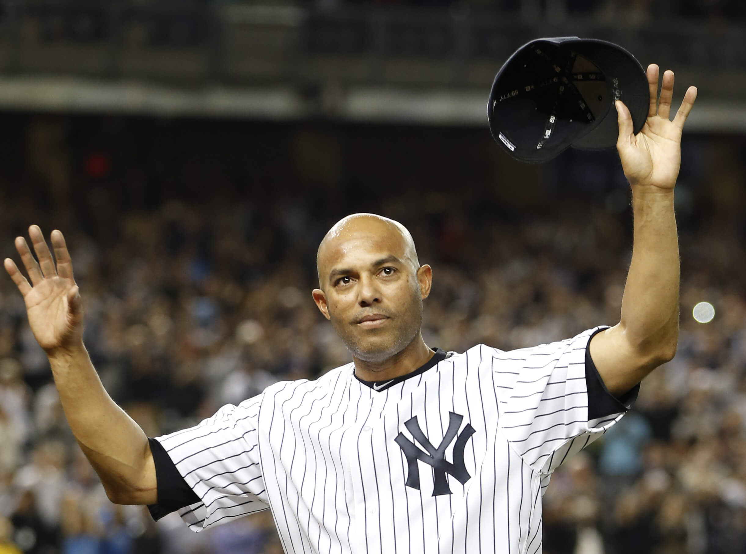 New York Yankees relief pitcher Mariano Rivera acknowledges the crowd's standing ovation Sept. 26, 2013, after coming off the mound in the ninth inning of his final appearance in a baseball game in New York.