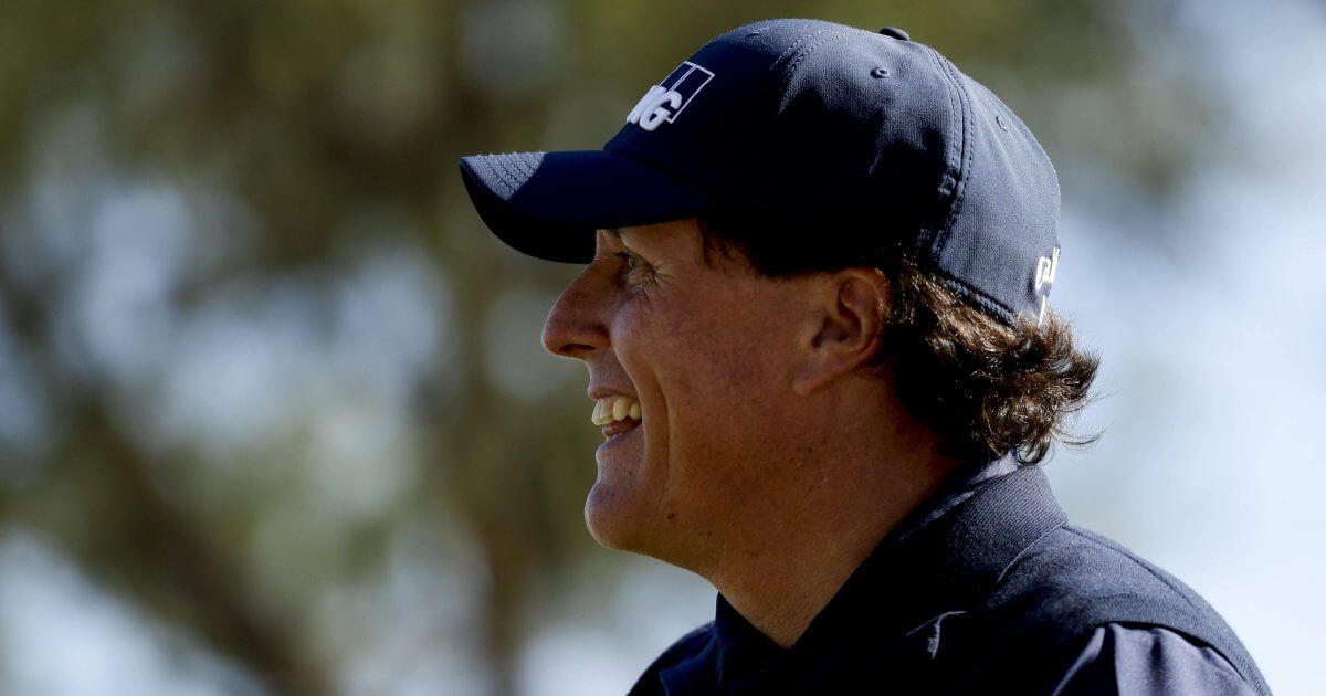 Phil Mickelson smiles after his tee shot on the fourth hole during the third round of the Desert Classic golf tournament on the Stadium Course at PGA West on Saturday in La Quinta, Calif.