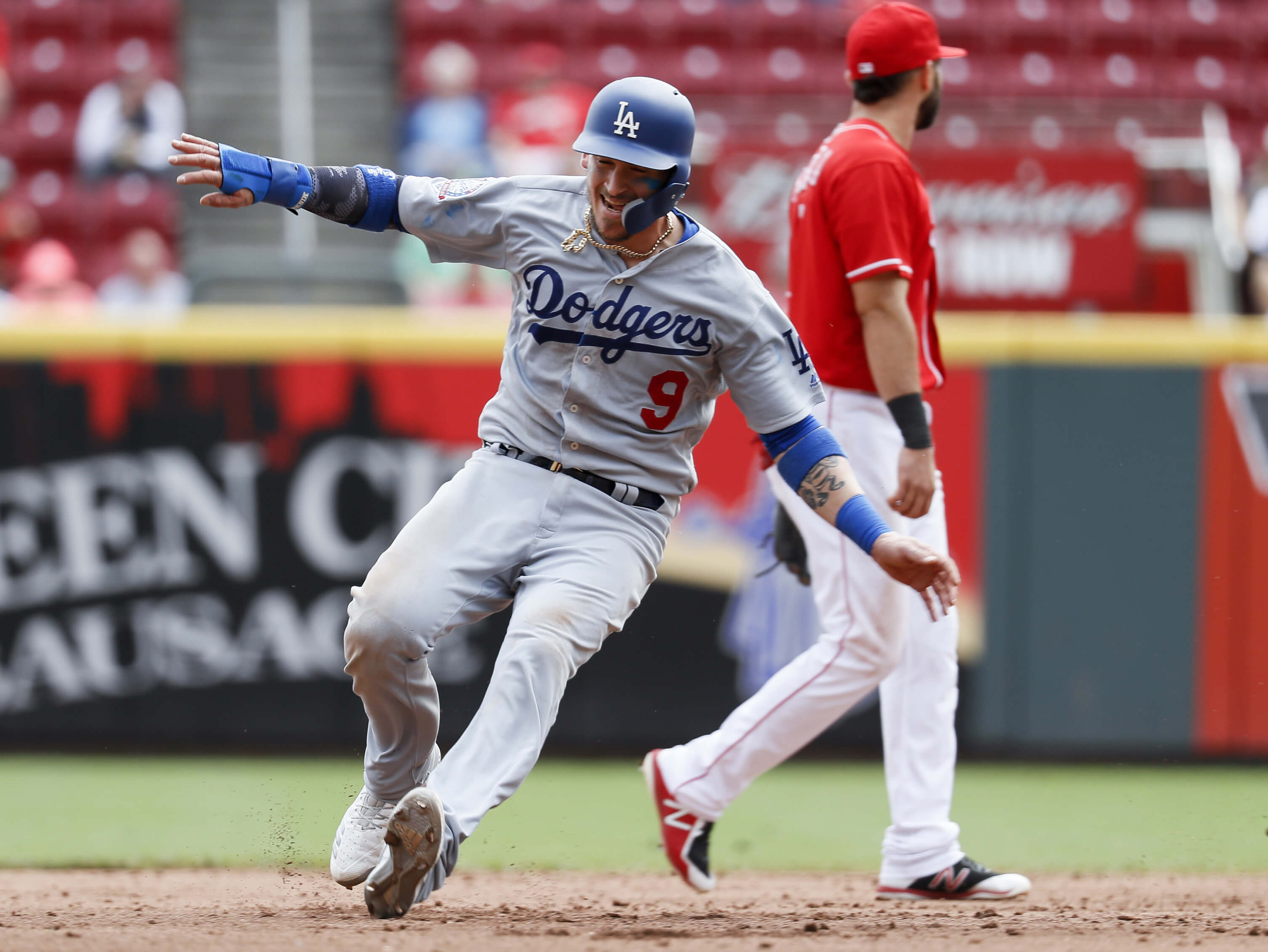 Yasmani Grandal advances to second on an error during the Los Angeles Dodgers' Sept. 12 game against the Cincinnati Reds.