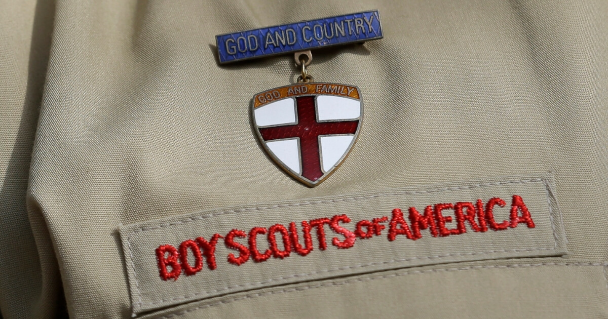 In this Feb. 4, 2013 file photo, shows a close up detail of a Boy Scout uniform worn during a news conference in front of the Boy Scouts of America headquarters in Irving, Texas.