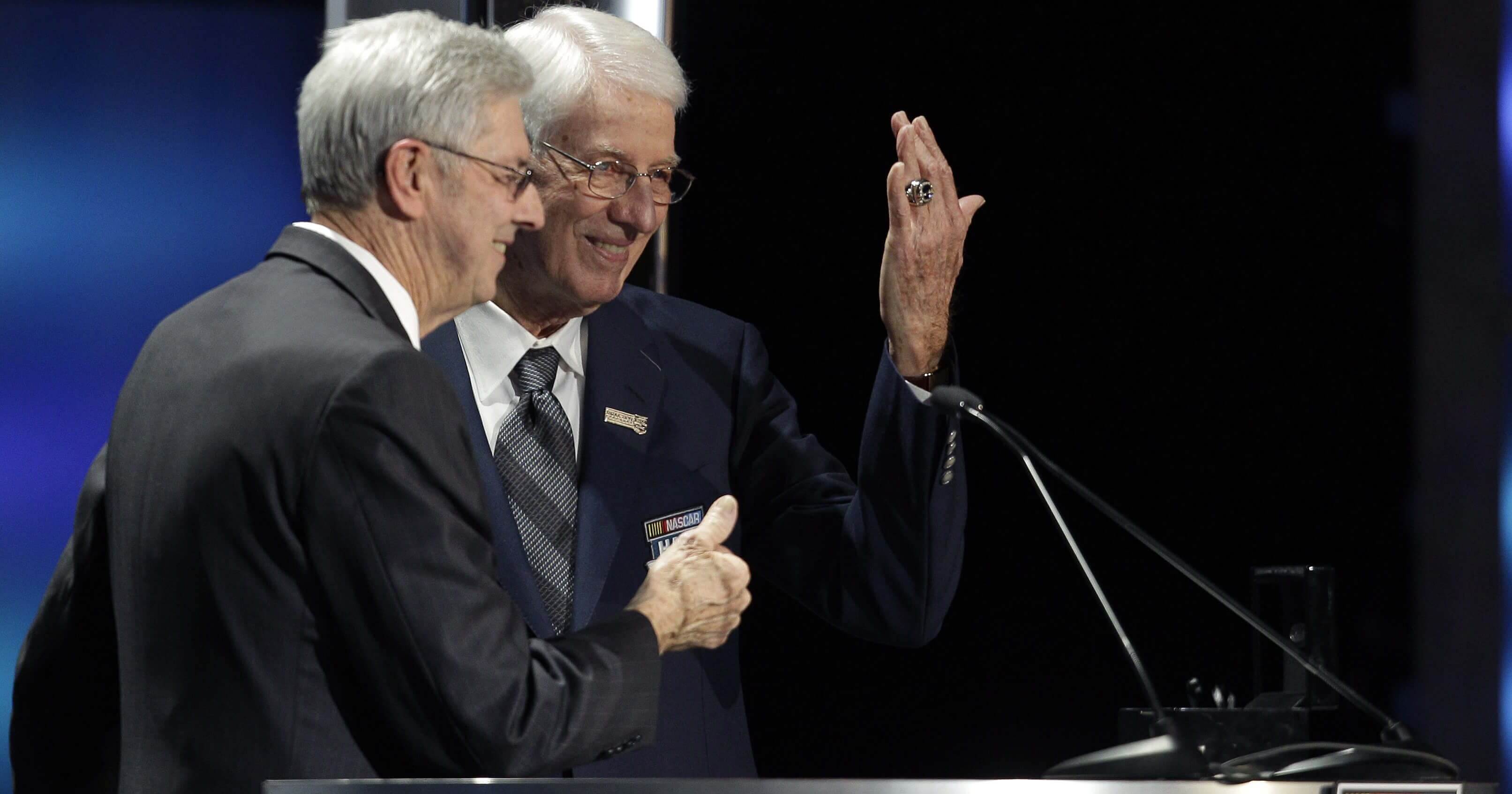 Glen Wood, right, shows off his induction ring as his brother, Leonard, left, looks on Jan. 20, 2012, during the NASCAR Hall of Fame induction ceremony in Charlotte, North Carolina.