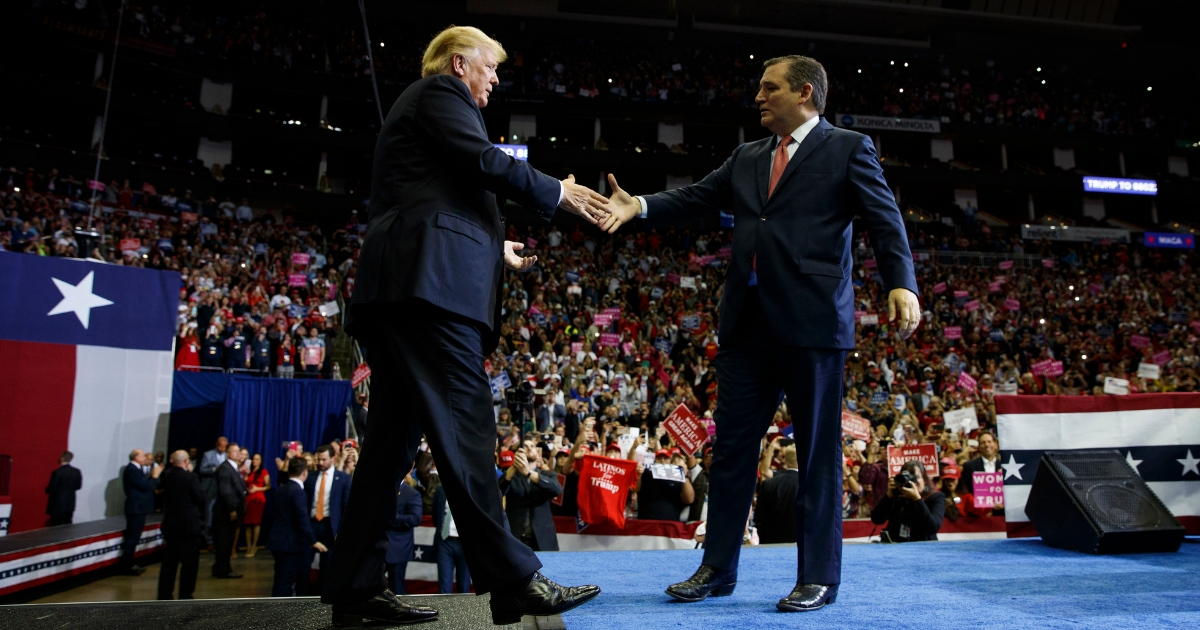 President Donald Trump is greeted by Sen. Ted Cruz, R-Texas, as he arrives for a campaign rally in Houston on Oct. 22, 2018.