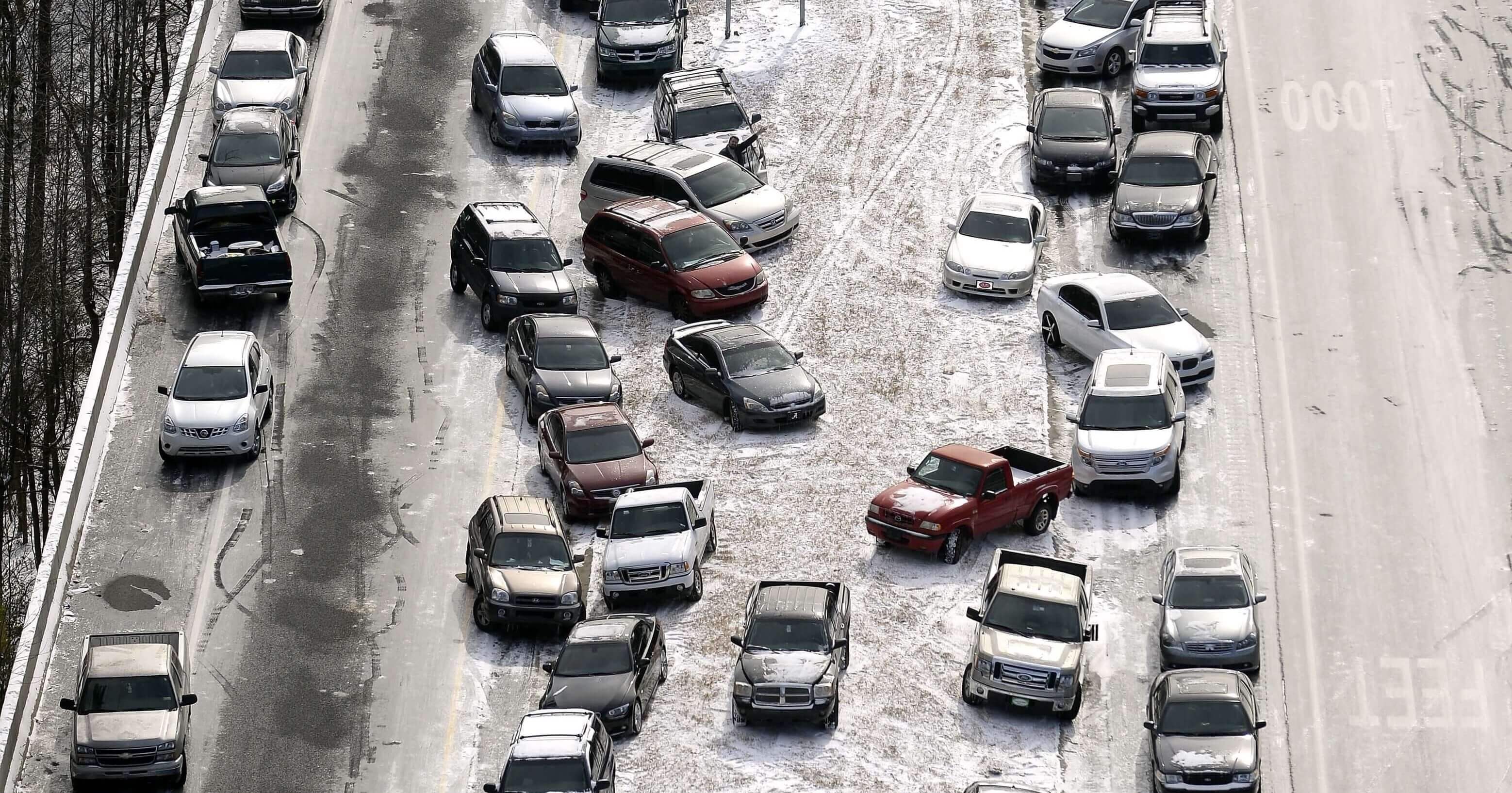 A Jan. 29, 2014, aerial photo shows abandoned cars at I-75 near the Chattahoochee River overpass piled up in the median of the ice-covered interstate after a winter snow storm in Atlanta.
