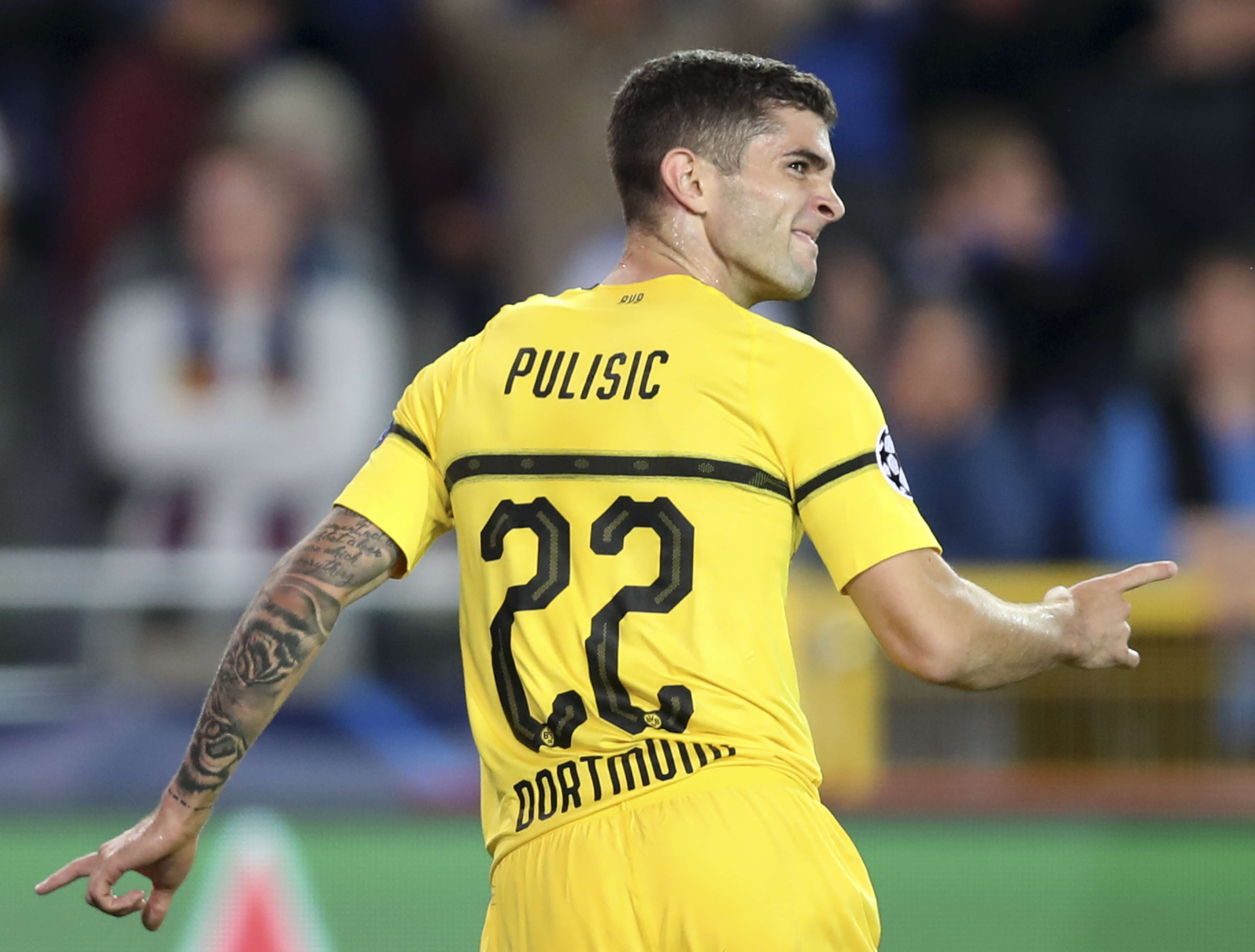 Borussia Dortmund's Christian Pulisic celebrates scoring his side's first goal during a Champions League group A soccer match between Club Brugge and Borussia Dortmund at the Jan Breydel Stadium in Bruges, Belgium, on Sept. 18.
