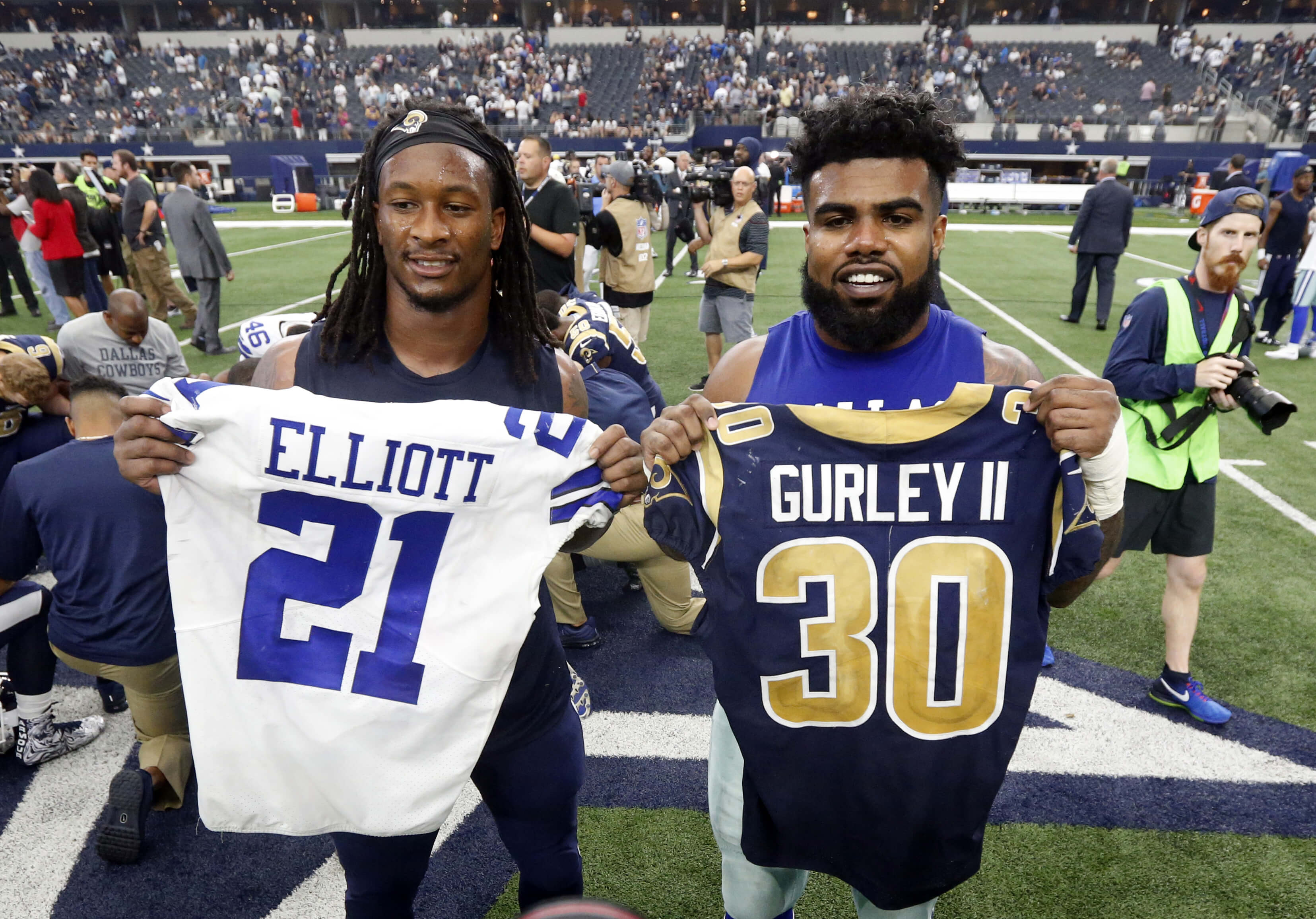 The Los Angeles Rams' Todd Gurley, left, and the Dallas Cowboys' Ezekiel Elliott, right, swap jerseys after an Oct. 1, 2017, game in Arlington, Texas.