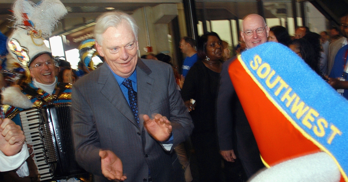 Southwest Airlines Chairman Herb Kelleher marches in a parade during a welcoming ceremony at Philadelphia International Airport.