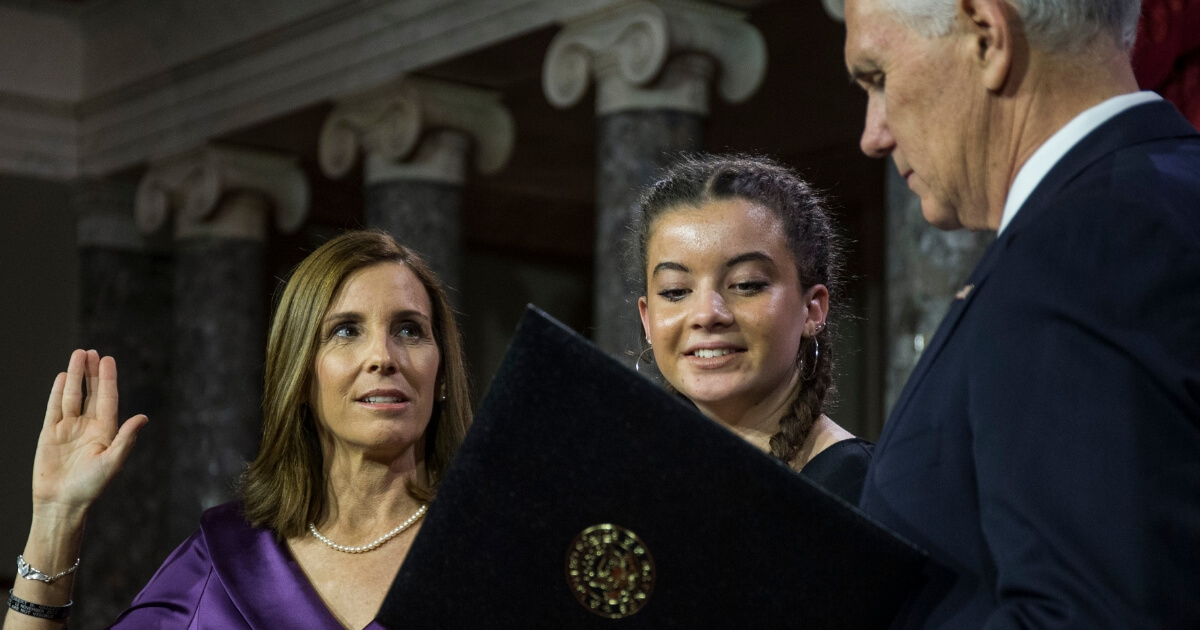 Senator Martha McSally participates in a mock swearing in ceremony with Vice President Mike Pence on Capitol Hill.