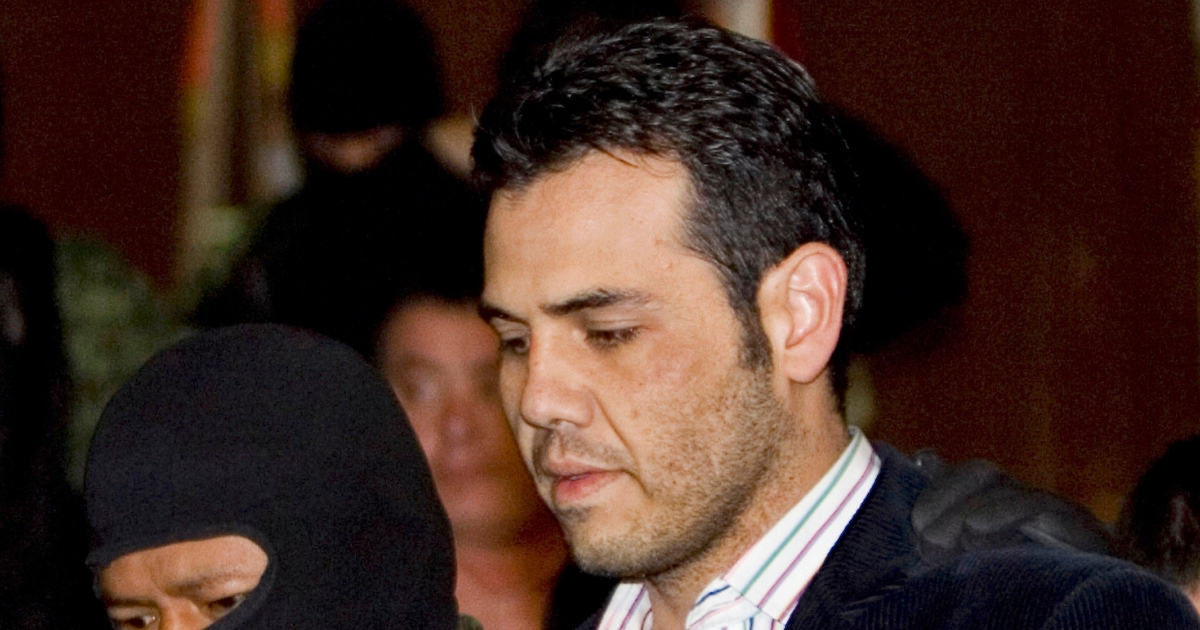 In this March 19, 2009, photo, military officers escort alleged drug trafficker Jesus Vicente Zambada Niebla during his presentation to the media in Mexico City.