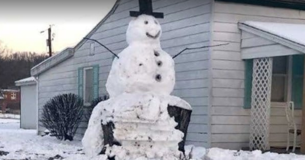 Snowman on stump