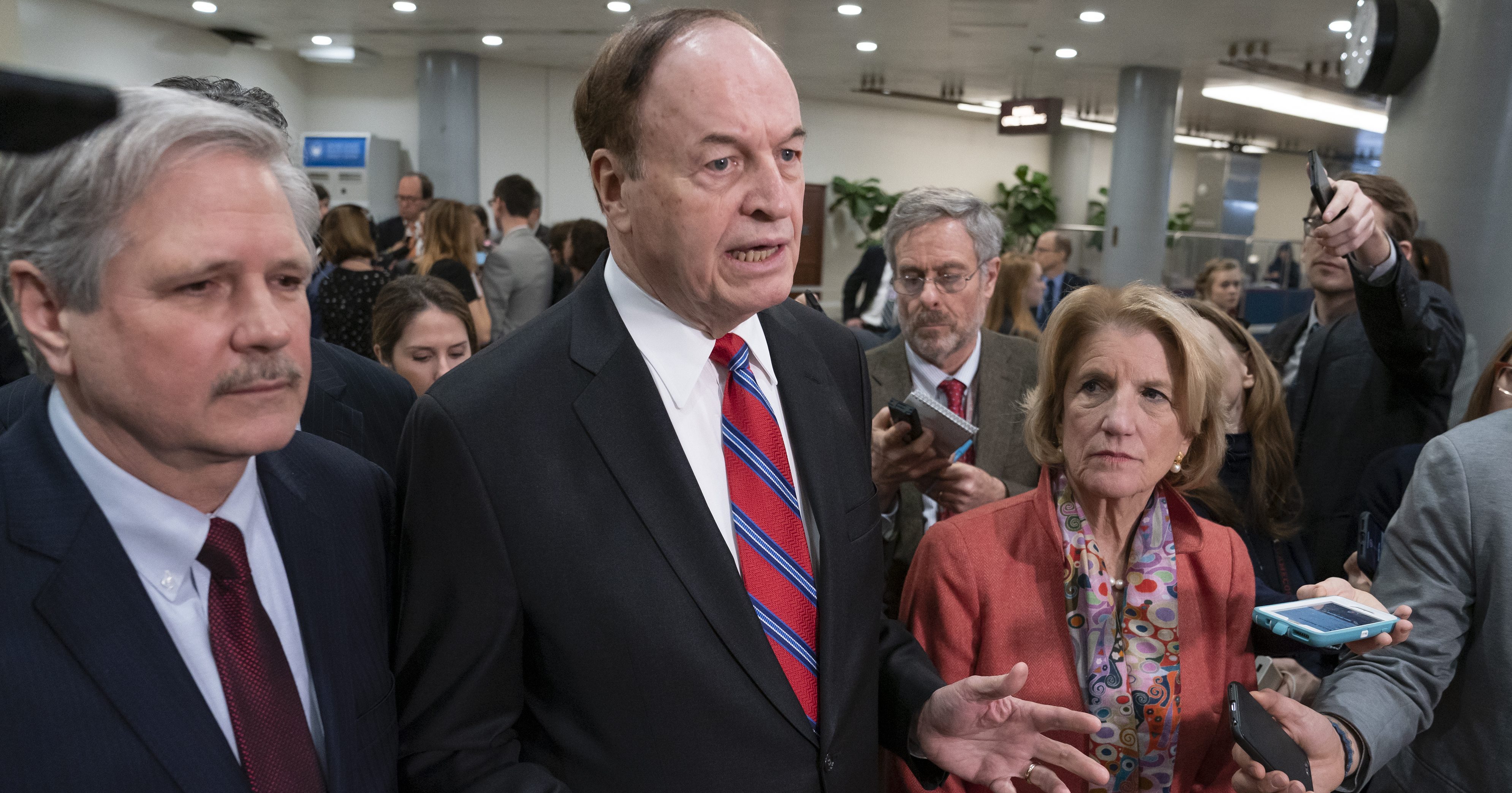 Sen. Richard Shelby, R-Ala., the top Republican on the bipartisan group working to craft a border security compromise in hope of avoiding another government shutdown, is joined by Sen. John Hoeven, R-N.D., left, and Sen. Shelley Moore Capito, R-W.Va., right, as they speak with reporters in Washington on Wednesday.