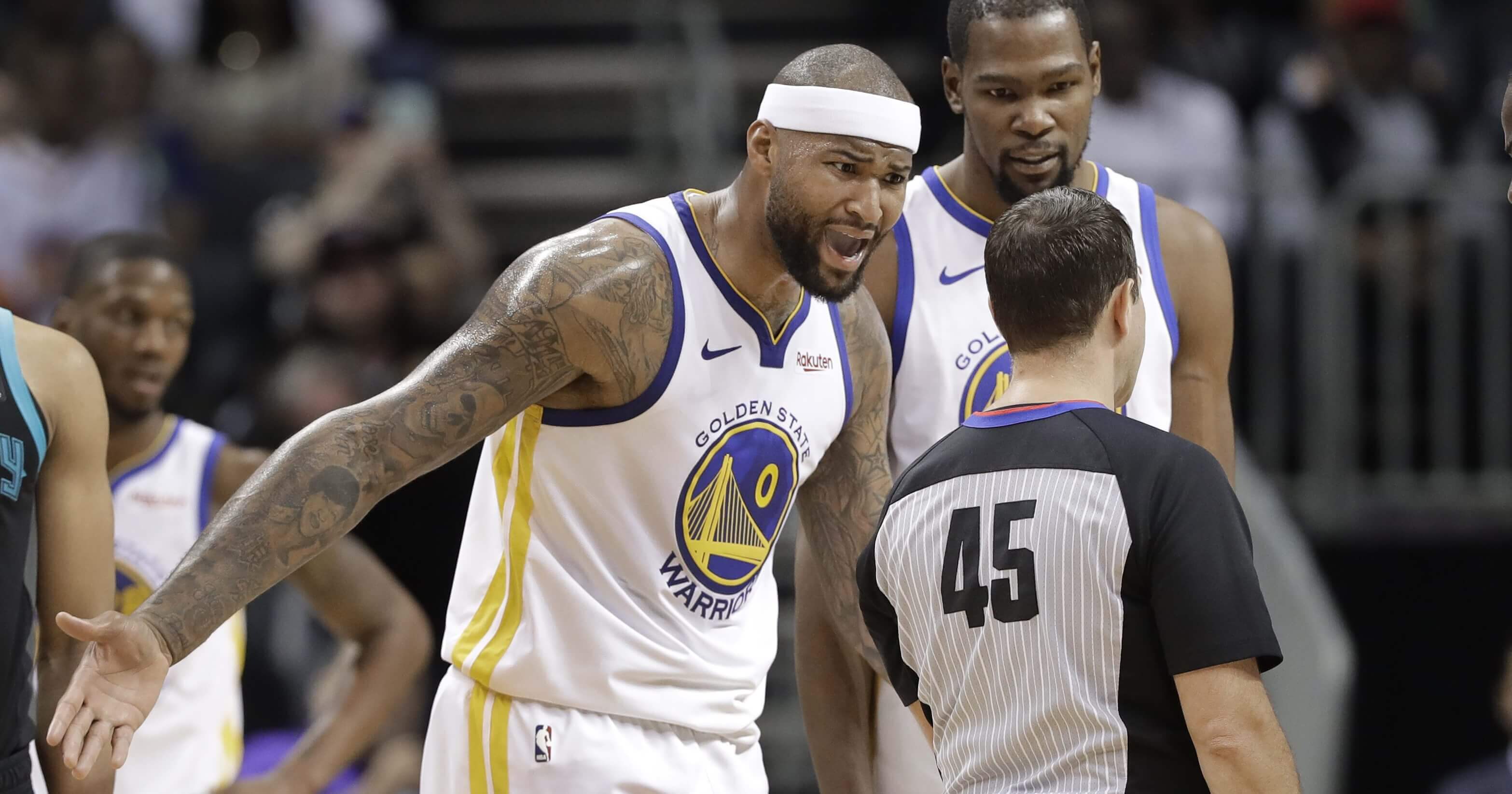 Golden State Warriors' DeMarcus Cousins reacts to being called for a technical foul by referee Brian Forte during the second half against the Charlotte Hornets in Charlotte, N.C., on Monday.