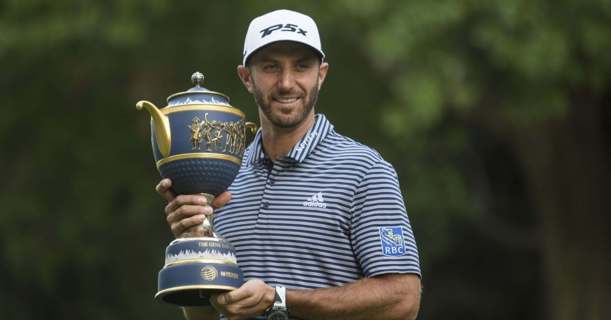 U.S. golfer Dustin Johnson poses with his Mexico Championship trophy at the Chapultepec Golf Club in Mexico City on Sunday.