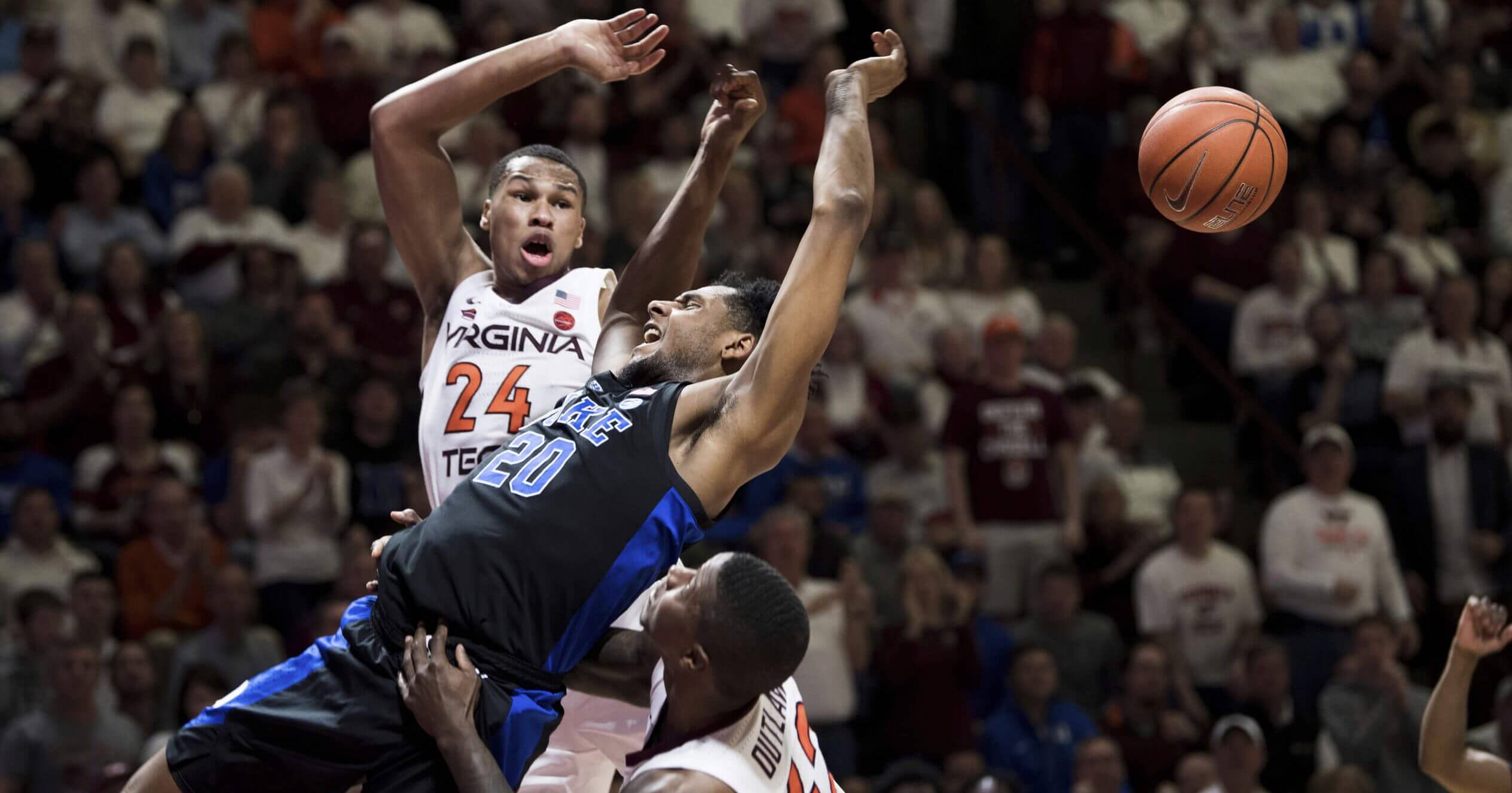 Duke center Marques Bolden is fouled as Virginia Tech's Kerry Blackshear Jr. (24) and Ty Outlaw (42) defend during Tuesday's game in Blacksburg, Virginia