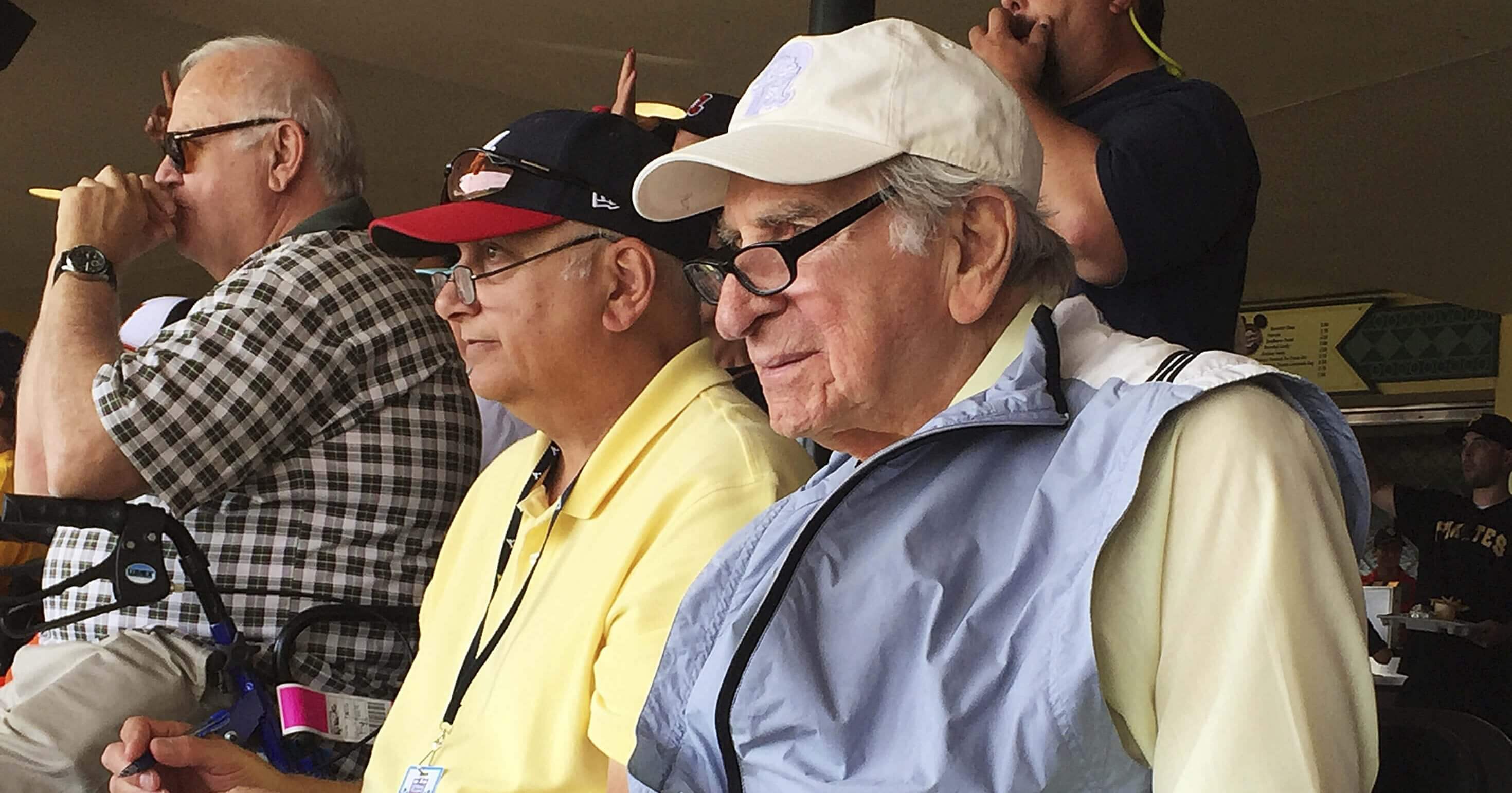 In this March 5, 2016, file photo, Tommy Giordano, right, special assistant to the general manager of the Atlanta Braves, scouts a spring training baseball game between the Braves and the Pittsburgh Pirates in Kissimmee, Florida.