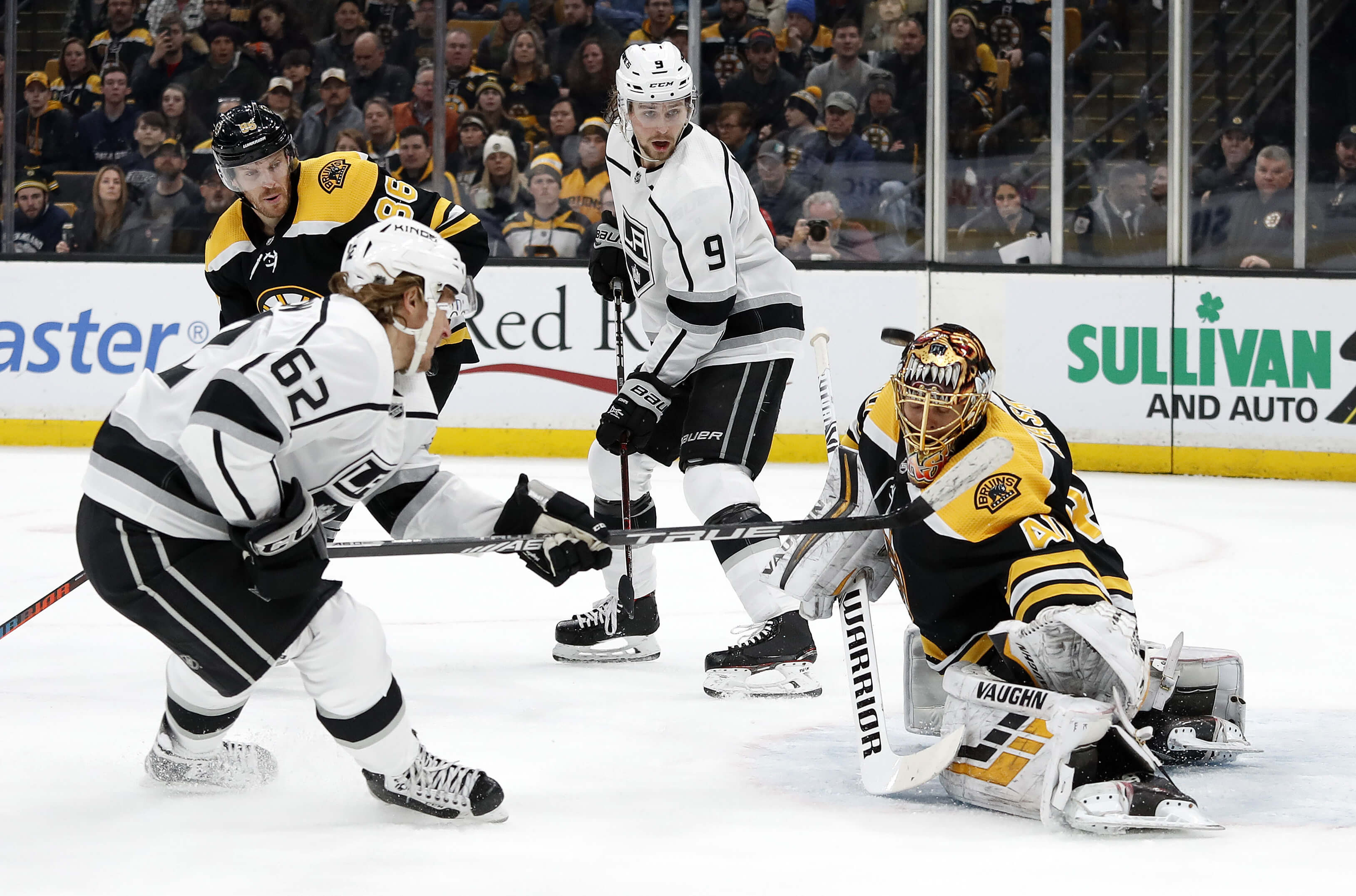 Boston Bruins goaltender Tuukka Rask takes a shot off his mask by the Los Angeles Kings' Carl Hagelin during a Feb. 9 game in Boston.