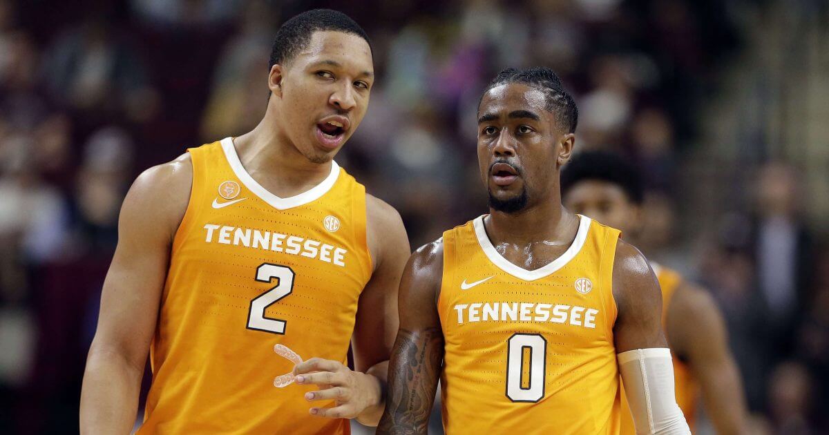 Tennessee forward Grant Williams (2) and guard Jordan Bone (0) talk as they head to the free throw line after a foul during the first half of an NCAA college basketball game against Texas A&M on Saturday in College Station, Texas.