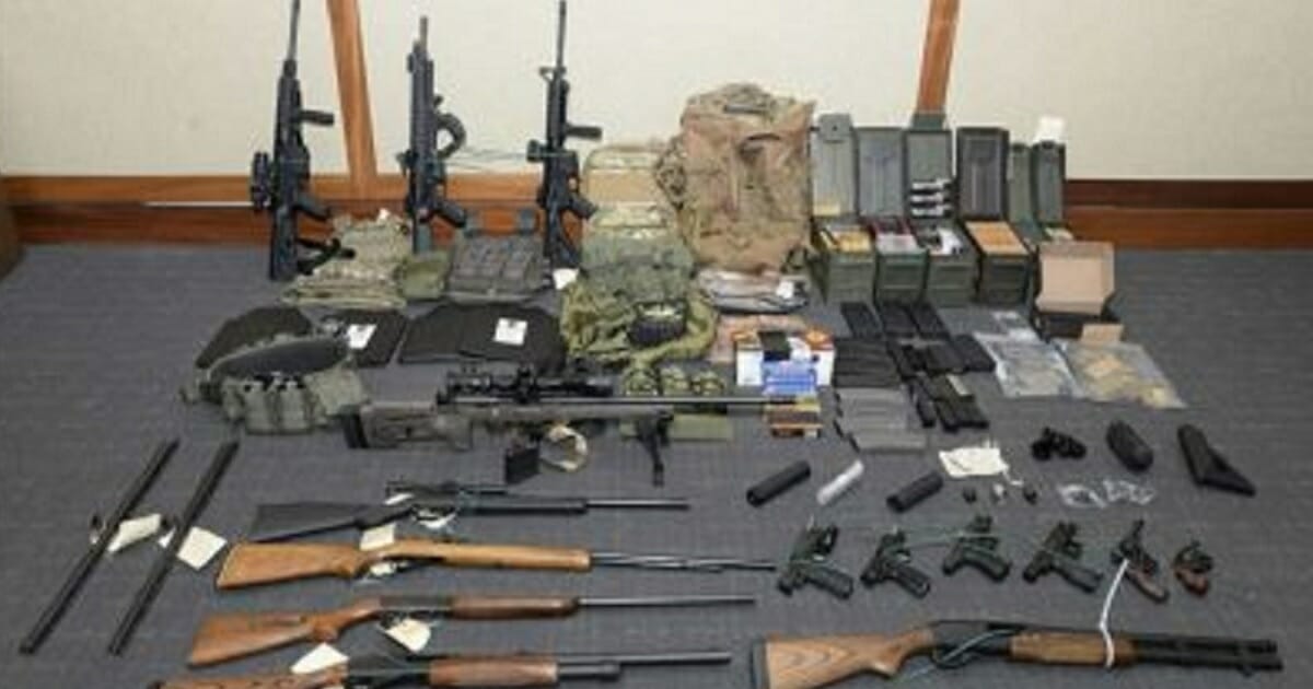 An image provided by the U.S. District Court in Maryland shows a photo of firearms and ammunition that was in the motion for detention pending trial in the case against Christopher Paul Hasson.