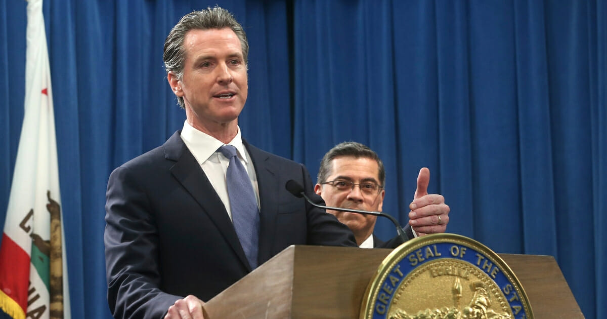 California Gov. Gavin Newsom answers a question concerning a lawsuit the state will likely file against President Donald Trump.