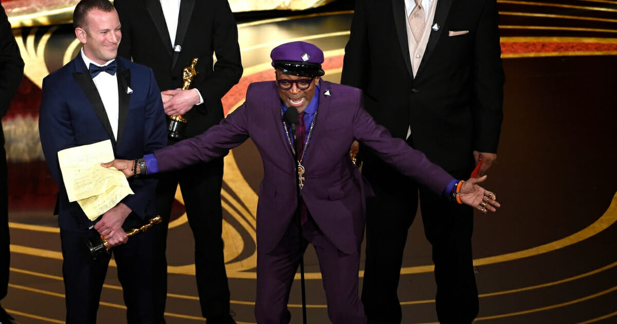 Charlie Wachtel and Spike Lee accept the award for best adapted screenplay for "BlacKkKlansman" at the Oscars.