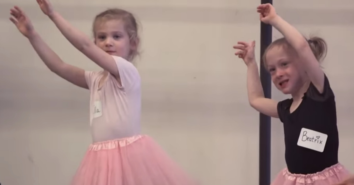 Two little girls dancing.