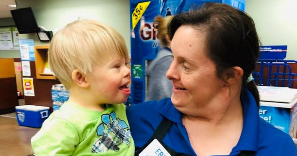 A little boy with Down syndrome and a woman with Down syndrome.