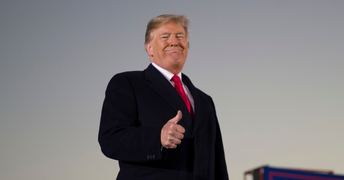 President Donald Trump giving two thumbs up.