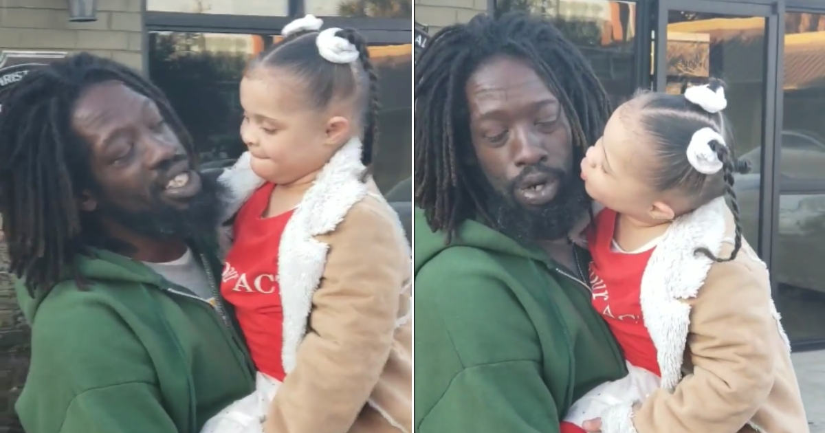 Little girl singing with a homeless man