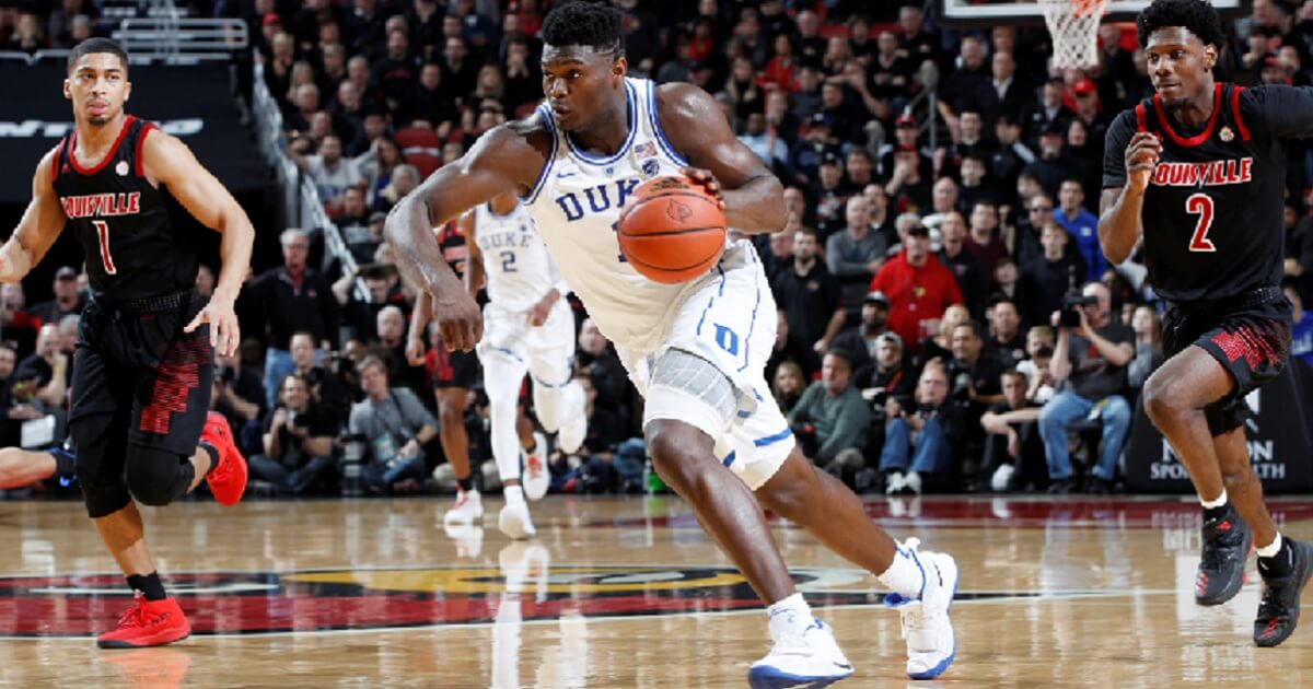 Duke Blue Devils' Zion Williamson drives to the basket against the Louisville Cardinals during the second half of Tuesday nignt's game in Louisville.