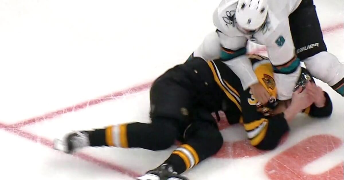 Evander Kane of the San Jose Sharks goes after the Boston Bruins' Zdeno Chara after a hit Tuesday night.