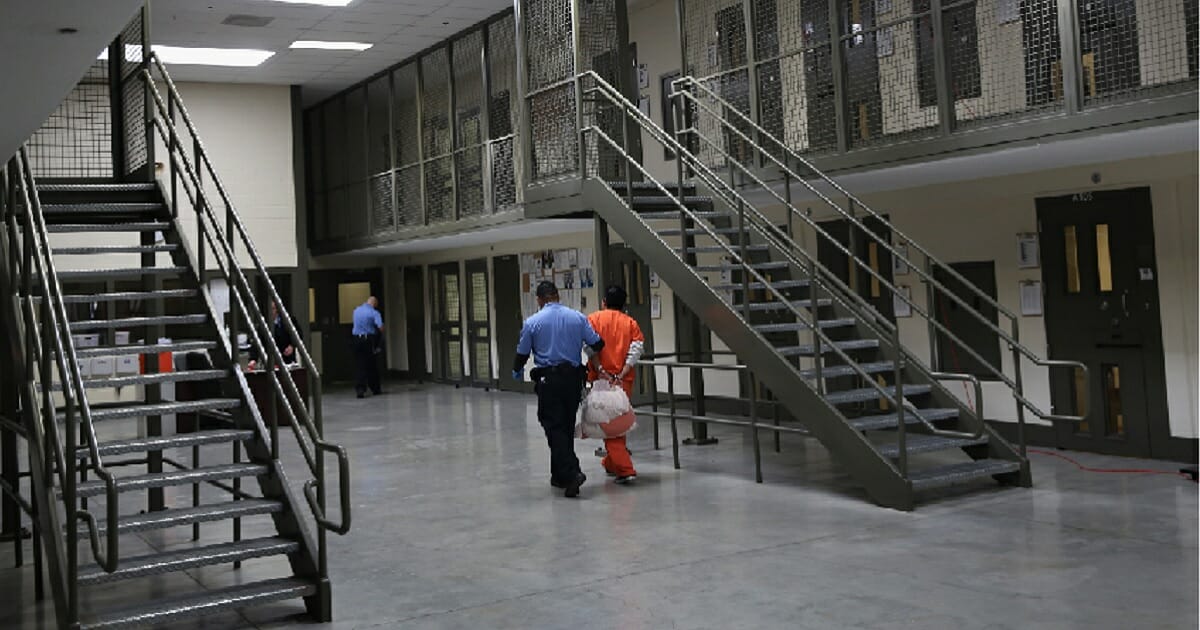 A file photo from 2013 shows the inside of an Immigration and Customs Enforcement processing center in Adelanto, California, run by the private prison corportation GEO Group.