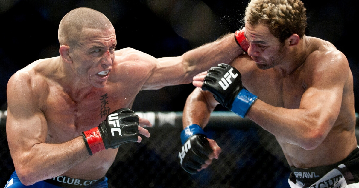 Georges St. Pierre, left, punches Josh Koscheck during the third round of the Ultimate Fighting Championship on Dec. 11, 2010, at Bell Centre in Montreal, Quebec.