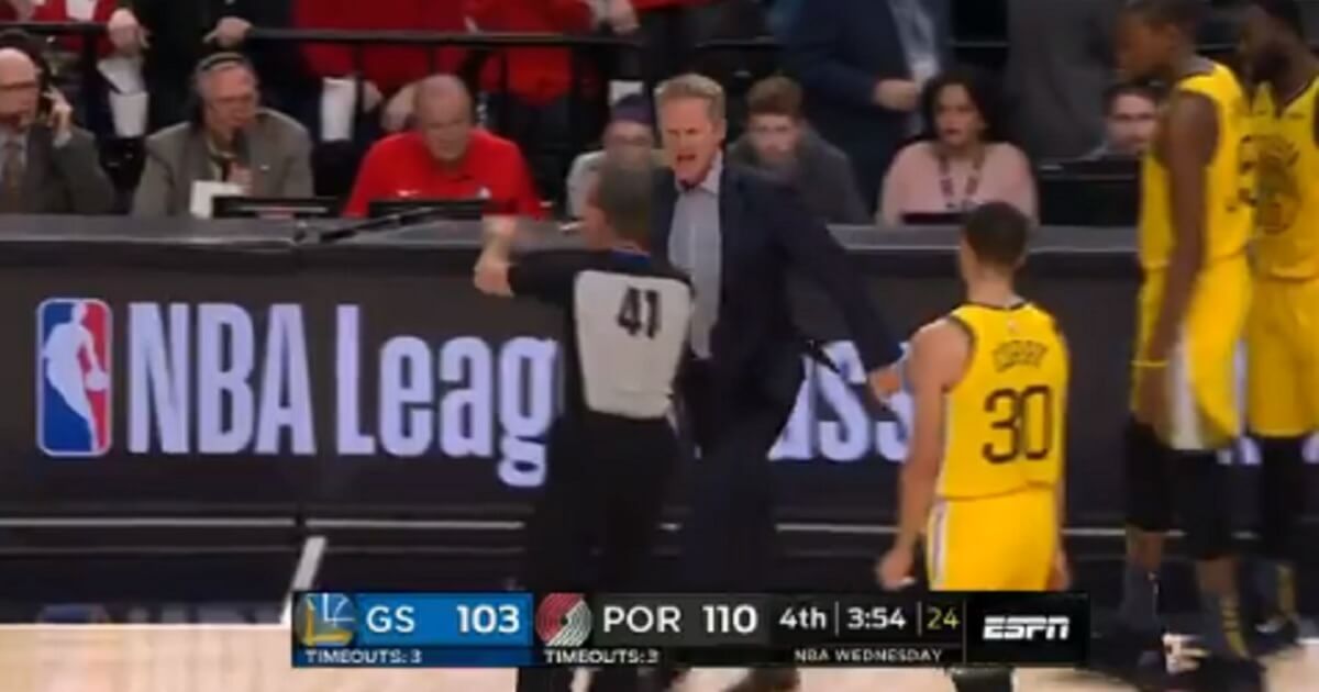Golden State Warriors Steve Kerr argues with a referee Wednesday after a call.