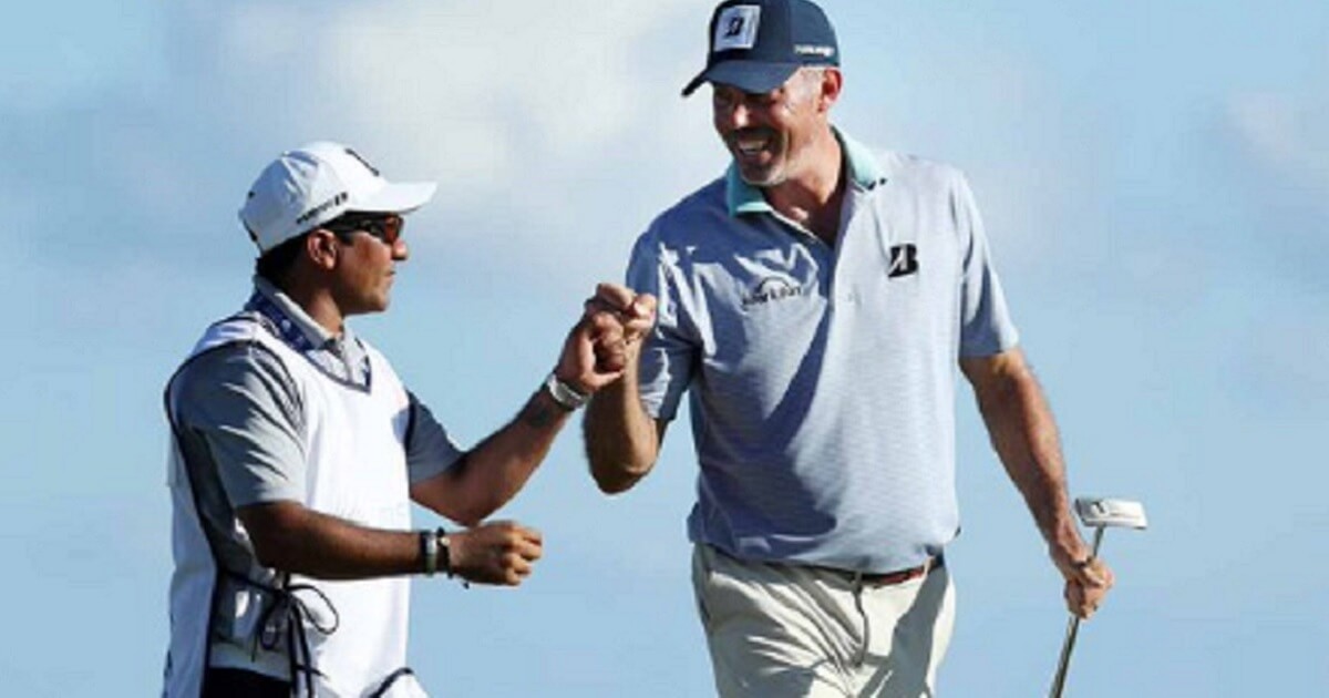 Golfer Matt Kuchar and caddie David "El Tucan" Ortiz