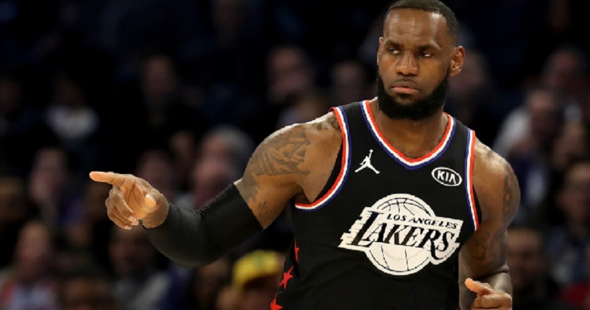 Los Angeles Lakes star LeBron James gestures on the court during the first half of Sunday's NBA All-Star Game in Charlotte, North Carolina.