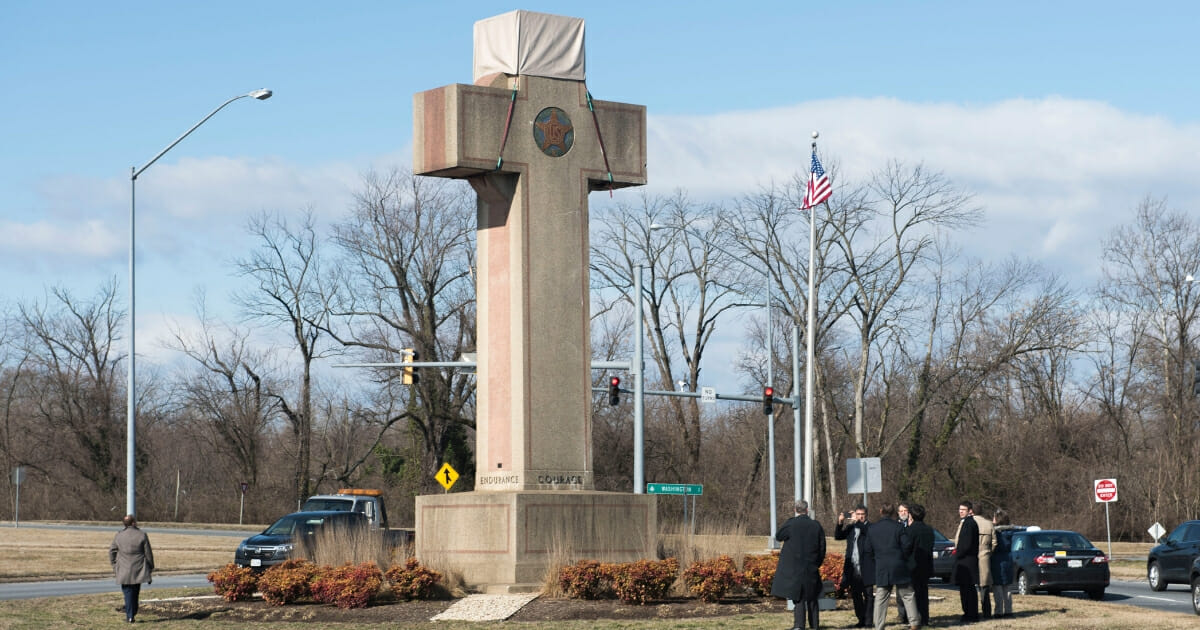 Visitors walk around the 40-foot Maryland Peace Cross dedicated to World War I soldiers in Bladensburg on Wednesday.
